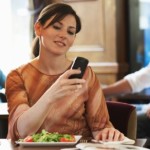 Woman on Phone in Restaurant